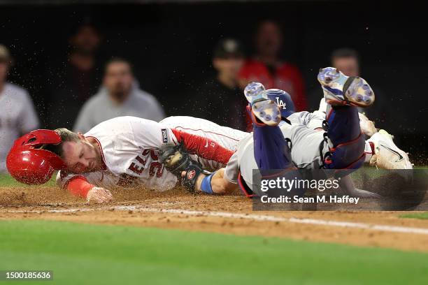 Brandon Drury of the Los Angeles Angels is tagged out at home plate by Will Smith of the Los Angeles Dodgers during the fourth inning of a game at...