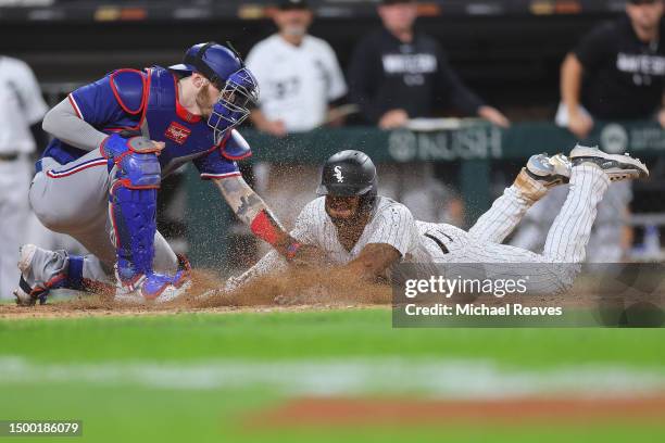 Jonah Heim of the Texas Rangers tags out Elvis Andrus of the Chicago White Sox as he attempts to score a run during the eighth inning at Guaranteed...