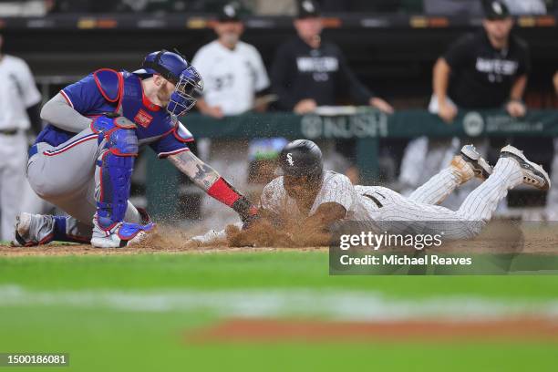 Jonah Heim of the Texas Rangers tags out Elvis Andrus of the Chicago White Sox as he attempts to score a run during the eighth inning at Guaranteed...