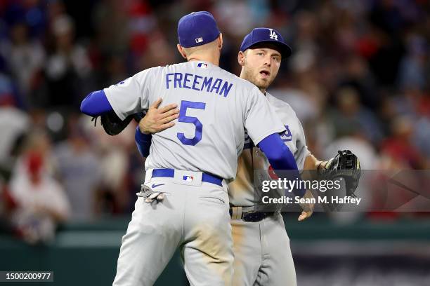 Michael Busch and Freddie Freeman of the Los Angeles Dodgers celebrate after defeating the Los Angeles Angels 2-0 in a game at Angel Stadium of...