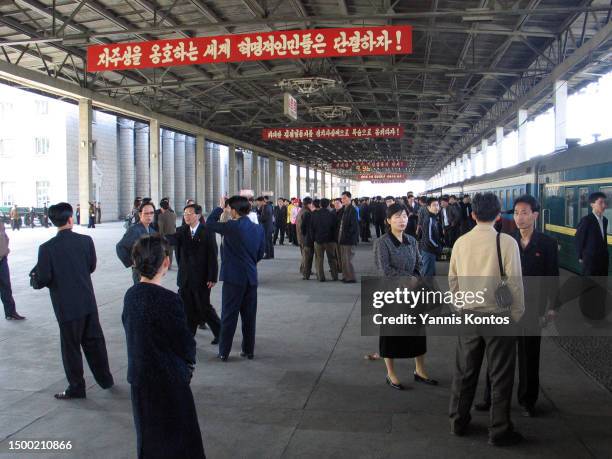 North Koreans gather at Pyongyang train station before embarking on their journey to Beijing, in May 07, 2005.