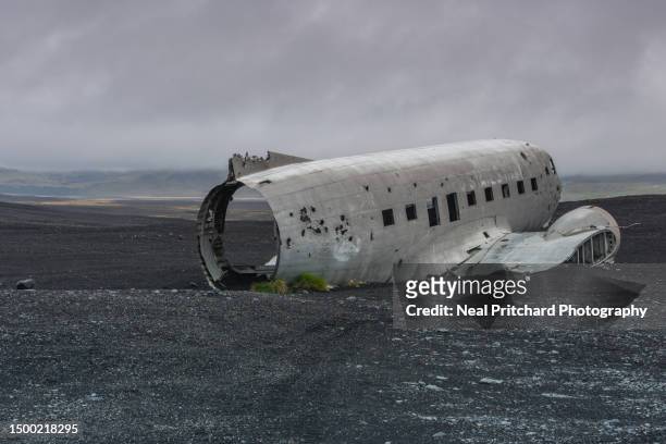 plane wreck on black sand beach iceland - icelandic phallological museum stock pictures, royalty-free photos & images