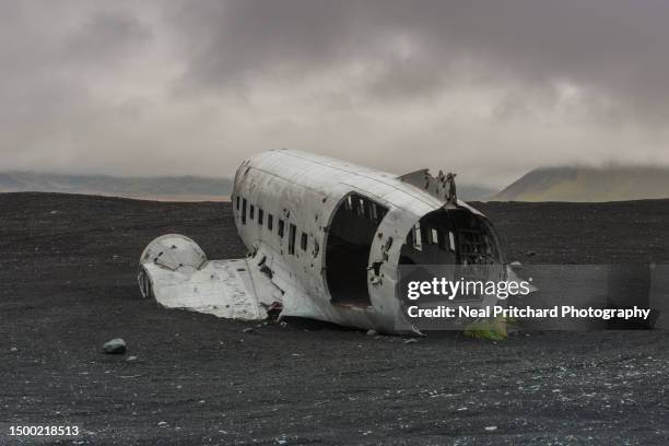 plane wreck on black sand beach iceland - icelandic phallological museum stock pictures, royalty-free photos & images