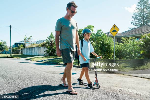 headed to the beach after school. - australian sidewalk stock pictures, royalty-free photos & images