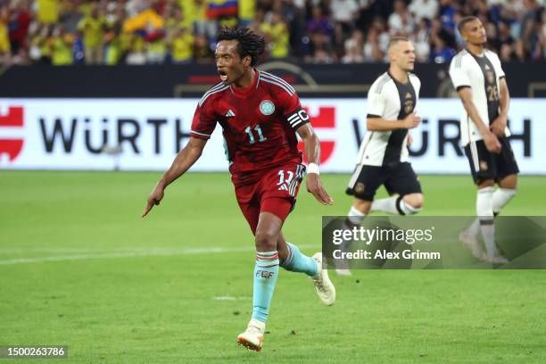 Juan Cuadrado of Colombia celebrates after scoring a penalty during the international friendly match between Germany and Colombia at Veltins-Arena on...