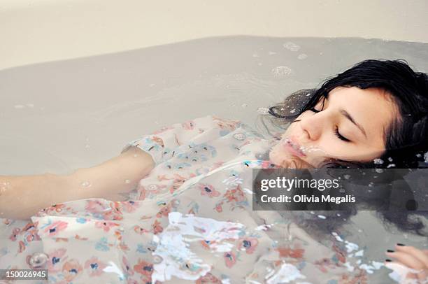 drowning in bathtub - drowning girl stock pictures, royalty-free photos & images