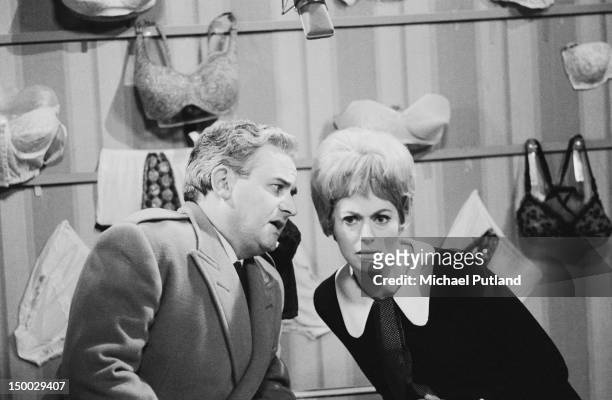 English comic actors Ronnie Barker and Josephine Tewson performing a sketch set in a lingerie shop, on the David Frost TV show, 8th December 1968.