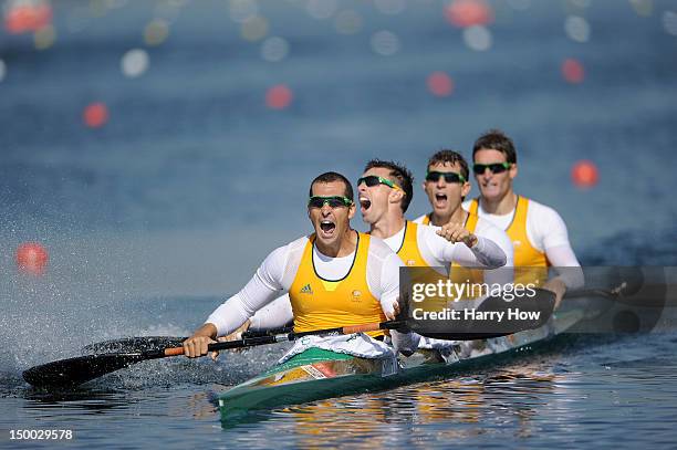 Tate Smith, Dave Smith, Murray Stewart, and Jacob Clear of Australia celebrate winning the Gold medal in the Men's Kayak Four 1000m Canoe Sprint on...