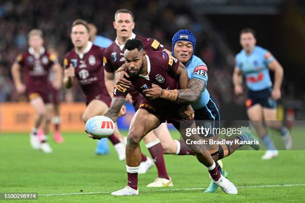 Hamiso Tabuai-Fidow of the Maroons is tackled by Brian To’o of the Blues during game two of the State of Origin series between the Queensland Maroons...