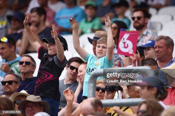 Fans enjoy the atmosphere during the Vitality T20 Blast match between Surrey CCC and Hampshire Hawks at The Kia Oval on June 18, 2023 in London,...