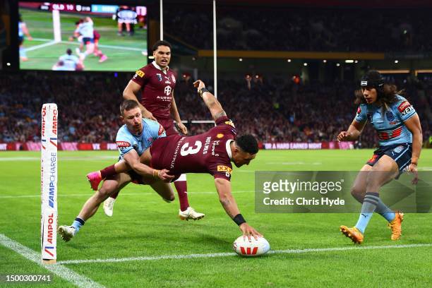 Valentine Holmes of the Maroons scores a try during game two of the State of Origin series between the Queensland Maroons and the New South Wales...