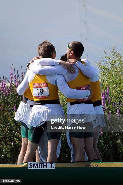 Tate Smith, Dave Smith, Murray Stewart, and Jacob Clear of Australia celebrate winning the Gold medal in the Men's Kayak Four 1000m Canoe Sprint on...