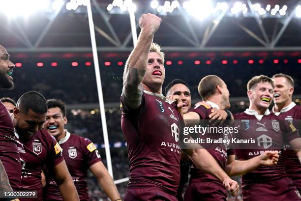 Cameron Munster of Queensland celebrates a try by team mate Hamiso Tabuai-Fidow of Queensland during game two of the State of Origin series between...