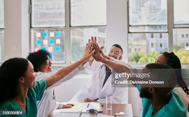 celebrating with a group of doctors and nurses after a successful surgery with copy space, stock photo - nursing assistant imagens e fotografias de stock