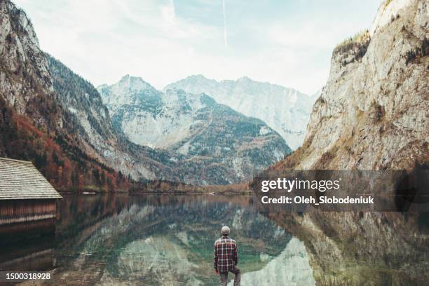 man looking at konigsee and enjoying the view of bavarian alps - provence alpes cote dazur stock pictures, royalty-free photos & images