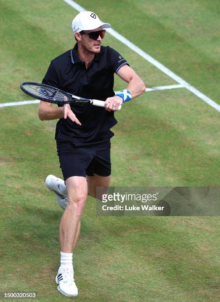 Jamie Murray of Great Britain plays a forehand with Michael Venus of New Zealand during their match against Rohan Bopanna of India and Matthew Ebden...
