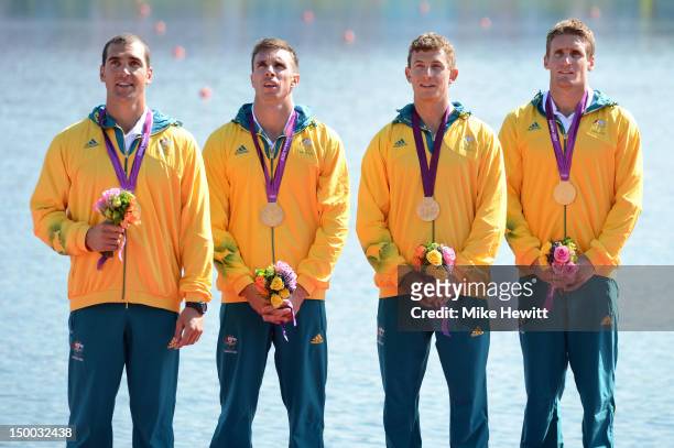 Tate Smith, Dave Smith, Murray Stewart, and Jacob Clear of Australia celebrate winning the Gold medal during the medal ceremony for the Men's Kayak...
