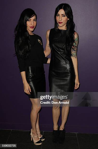 Jessica Origliasso and Lisa Origliasso pose prior to an exclusive live performance by British boy band, The Wanted, at the Nova Red Room on August 9,...