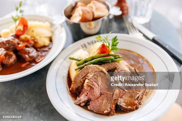 lamb with potatoes served in a french restaurant, paris, france - pot au feu stock-fotos und bilder