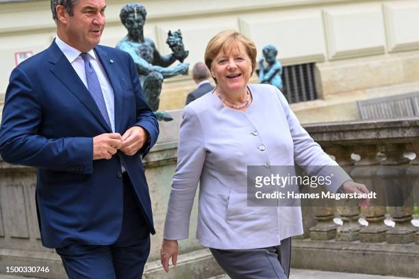 Markus Söder , Minister-President of Bavaria, greets Angela Merkel , former German Chancellor, in front of the Residenz. Prime Minister Soeder...