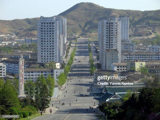 North Koreans walk in the streets in Kaesong, May 02, 2005.