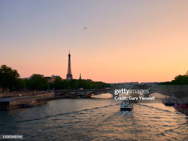 eiffel tower and river seine at sunset - seine maritime stock pictures, royalty-free photos & images