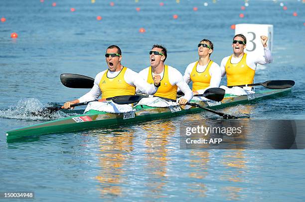 Tate Smith, Dave Smith, Murray Stewart, and Jacob Clear of Australia celebrate after winning the Gold medal in the Men's Kayak Four 1000m Canoe...