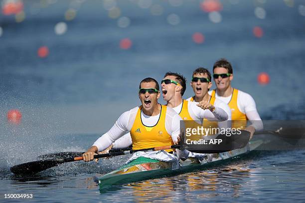 Tate Smith, Dave Smith, Murray Stewart, and Jacob Clear of Australia celebrate after winning the Gold medal in the Men's Kayak Four 1000m Canoe...