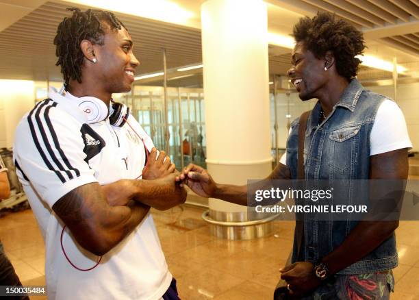 Anderlecht's Rubenilson Dos Santos da Rocha 'Kanu' and Standard de Liege's Antonio Pereira Dos Santos 'Kanu' joke at Brussels International Airport...