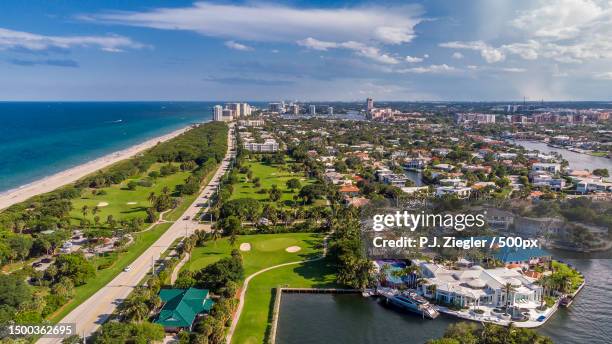 high angle view of city by sea against sky,boca raton,fl,united states,usa - palm beach county stock-fotos und bilder