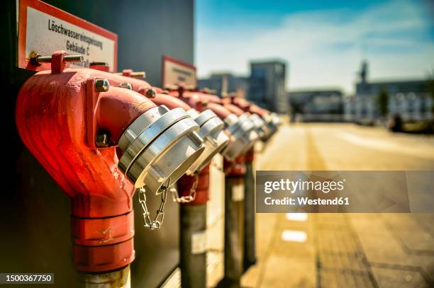 germany,†north rhine westphalia, fire hydrants in†media harbor - hydrant stock-fotos und bilder