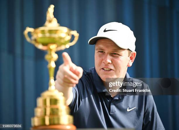 Robert MacIntyre of Scotland inspects The Ryder Cup trophy during the pro-am prior to the BMW International Open at Golfclub Munchen Eichenried on...