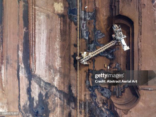 industrial machine working in an open-pit coal mine photographed from directly above, victoria, australia - gippsland stock pictures, royalty-free photos & images