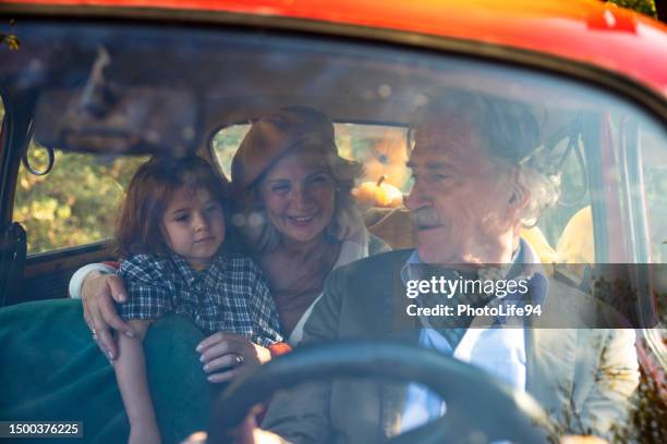 on a road trip with a grandchild! - grandma driving car stock pictures, royalty-free photos & images