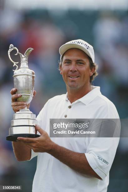 Tom Lehman of the United States holds the Claret Jug and celebrates after winning the 125th Open Championship on 21st July 1996 at the Royal Lytham...