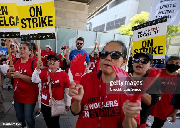 Los Angeles, CA - Striking members of the Unite Here Local 11 hotel workers union make noise on the picket line outside the JW Marriott and...
