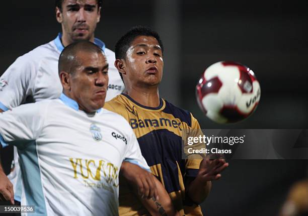 Jorge Campos of Merida fights for the ball with Daniel Ramirez of Pumas during a match between Pumas and Merida as part of the Copa MX 2012 at...