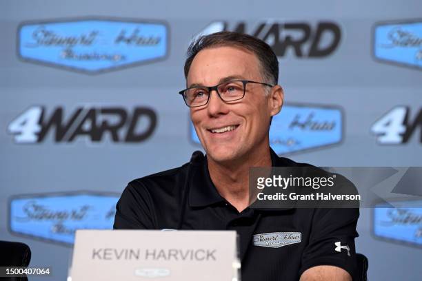Driver Kevin Harvick talks with the media during a press conference introducing Josh Berry as the new driver of the Stewart-Hass Racing Ford Mustang...