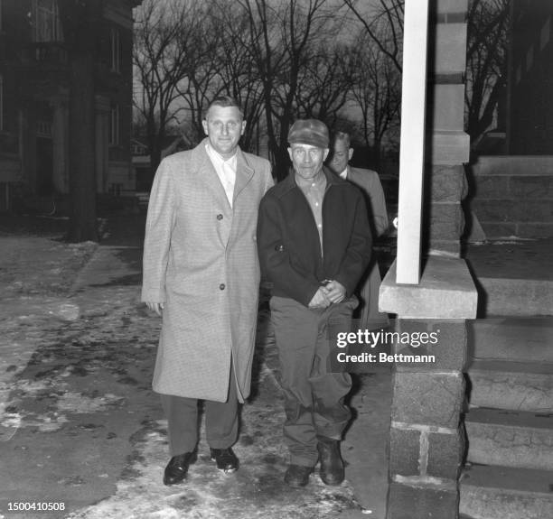 Farmer Ed Gein , confessed slayer of two women, stands with his attorney William Belter at the Wabsara County Court. Gein was charged with first...