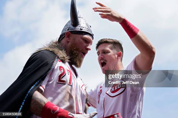 Jake Fraley of the Cincinnati Reds celebrates with Kevin Newman after hitting a two-run home run against the Colorado Rockies in the eighth inning of...