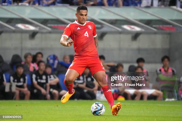 Anderson Santamaria of Peru in action during the international friendly match between Japan and Peru at Panasonic Stadium Suita on June 20, 2023 in...