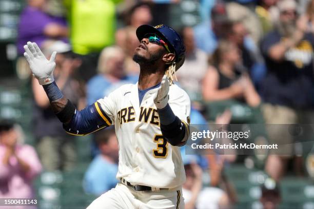 Raimel Tapia of the Milwaukee Brewers celebrates as he runs the bases after hitting a solo home run against the Arizona Diamondbacks in the fifth...