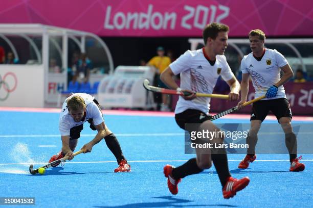 Moritz Furste of Germany scores his team's first goal during the Men's Hockey Semi Final match between Australia and Germany on Day 13 of the London...