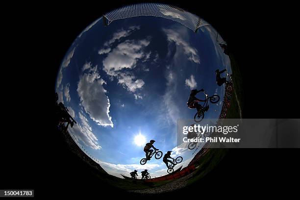 The field clear a jump during the Men's BMX Cycling Quarter Finals on Day 13 of the London 2012 Olympic Games at BMX Track on August 9, 2012 in...