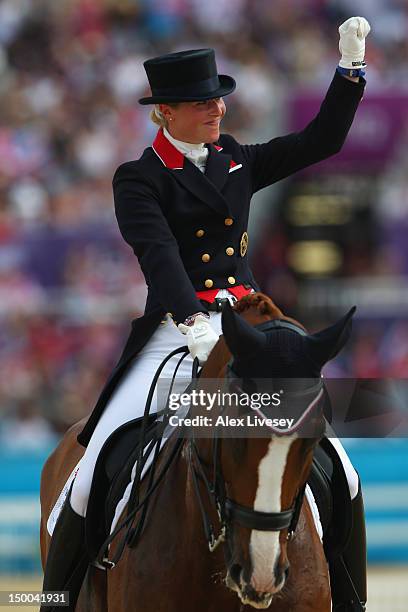 Laura Bechtolsheimer of Great Britain riding Mistral Hojris celebrates during the Individual Dressage on Day 13 of the London 2012 Olympic Games at...