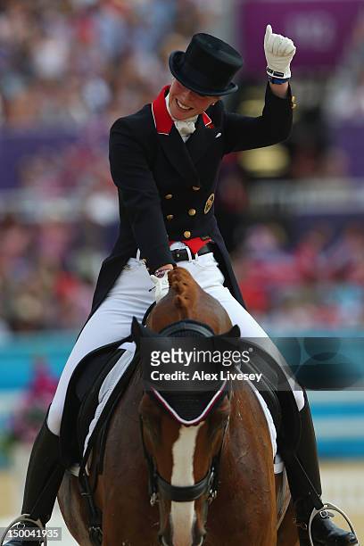 Laura Bechtolsheimer of Great Britain riding Mistral Hojris celebrates during the Individual Dressage on Day 13 of the London 2012 Olympic Games at...
