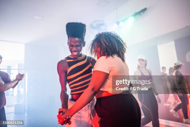 young friends on a class at dance studio - ballroom dancers stock pictures, royalty-free photos & images