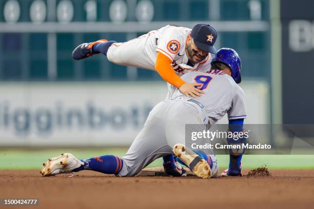 Brandon Nimmo of the New York Mets tagged out at second by Jose Altuve of the Houston Astros during the seventh inning at Minute Maid Park on June...