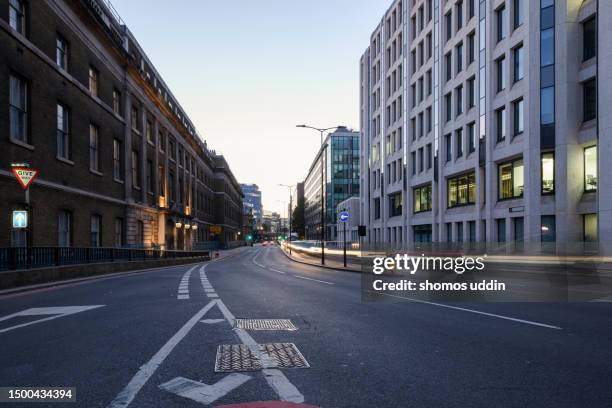 street of london financial district at dusk - urban road stock pictures, royalty-free photos & images