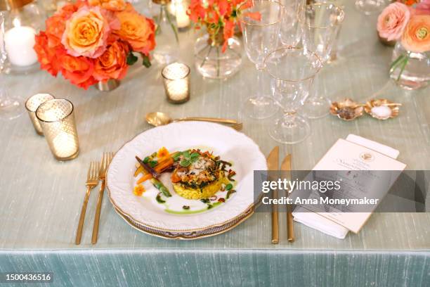 The main course that will be served, stuffed portobello mushrooms and creamy saffron-infused risotto, is displayed at a media preview of the state...